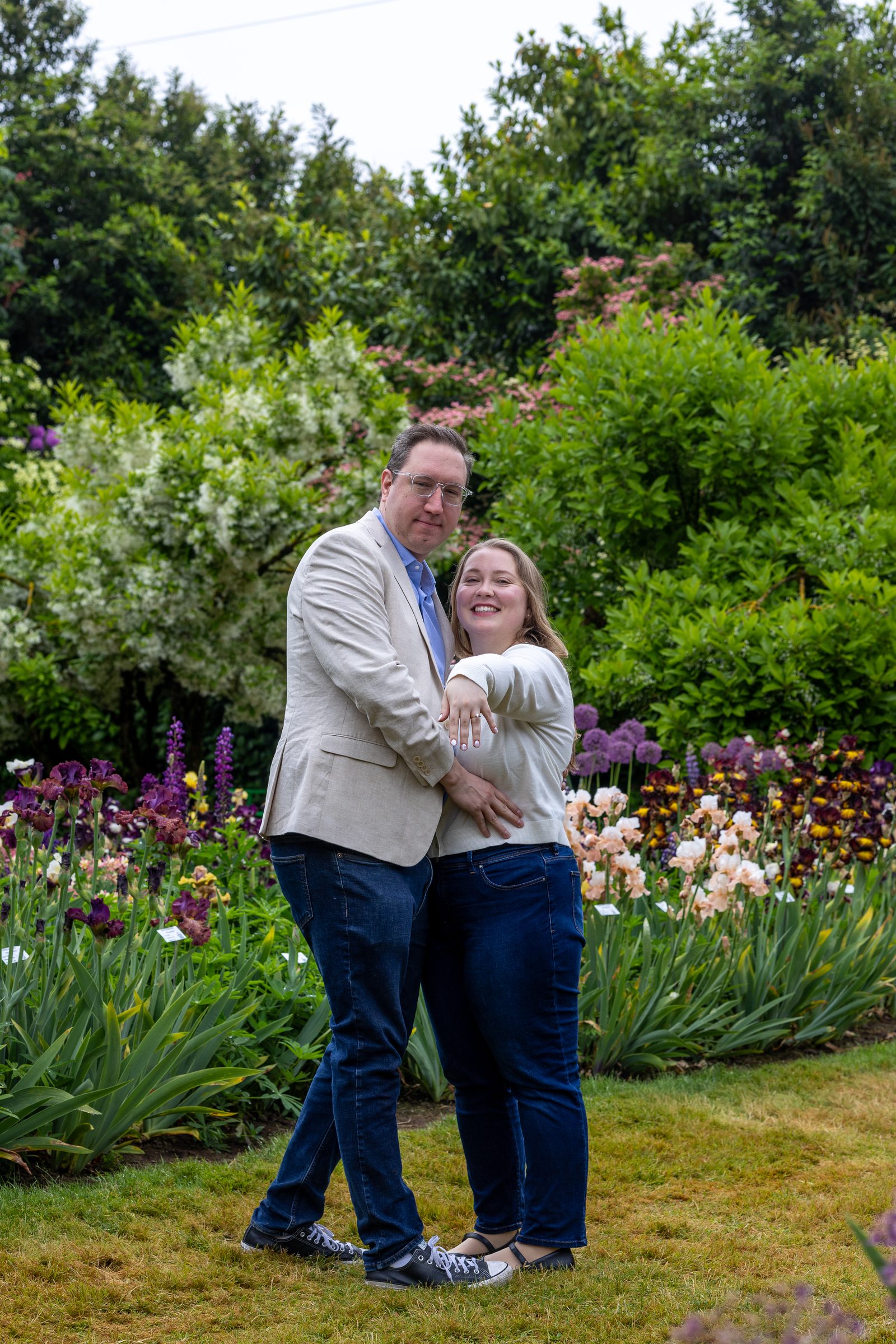 Rachel and Daniel embracing among the iris beds
